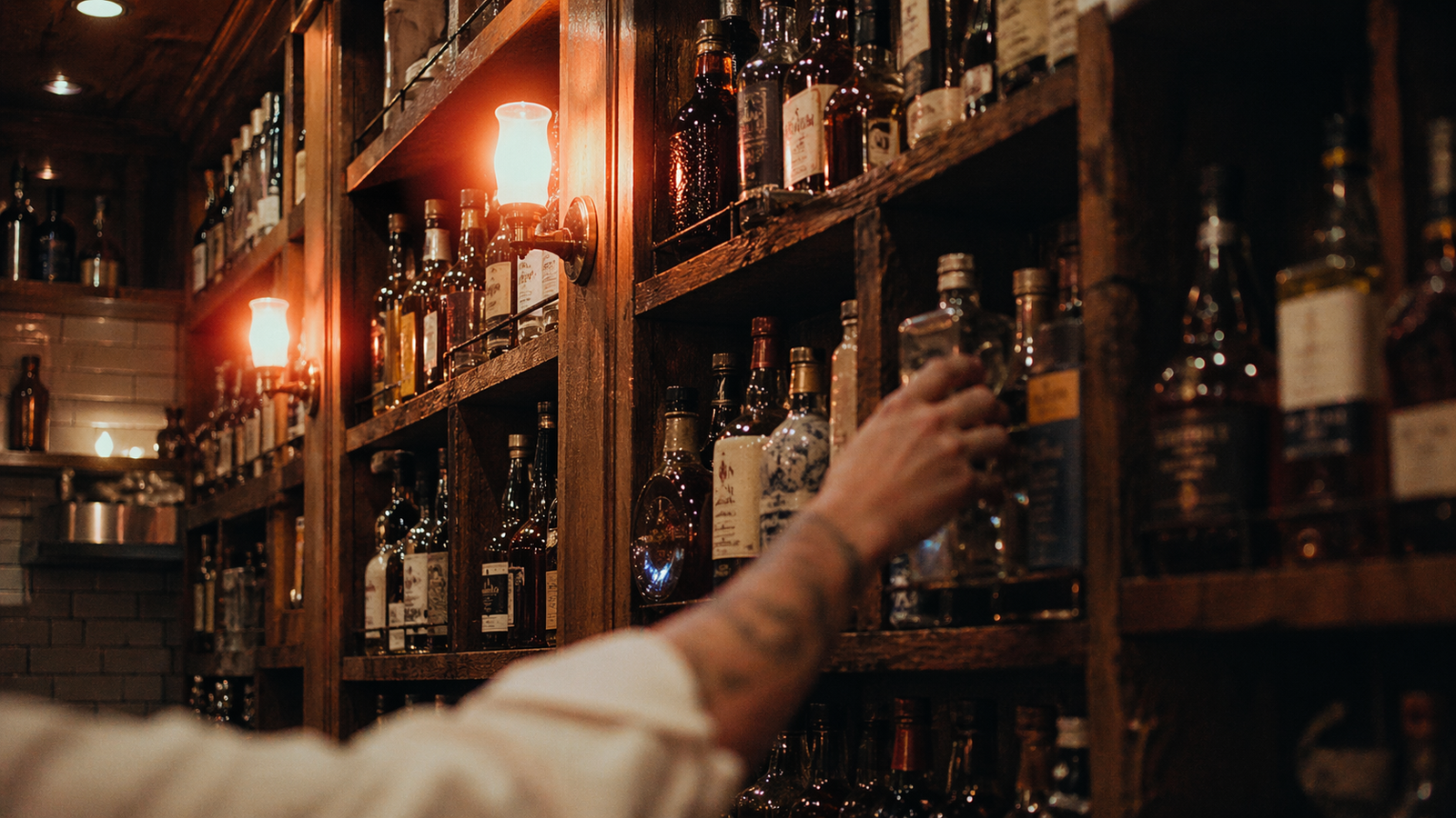 The 800-bottle Libation Library at Aroma Thyme Bistro — independent craft spirits and wines on reclaimed oak shelving