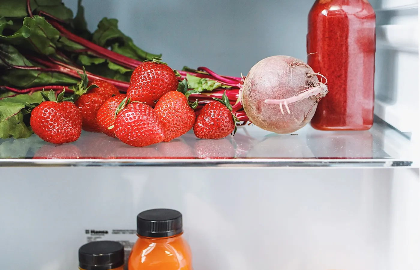 How to store produce with leafy greens kept dry inside a high-humidity refrigerator crisper.